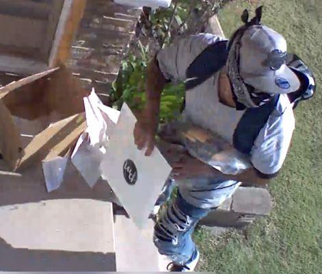 Thief alert! He's stealing mother's day gifts with our photos in it.