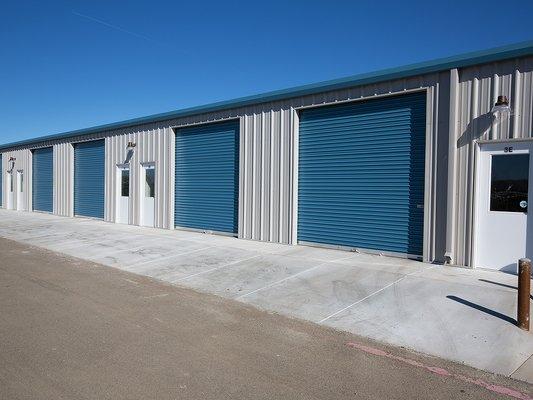 10' high roll up doors with a 3' wide man door to all units.