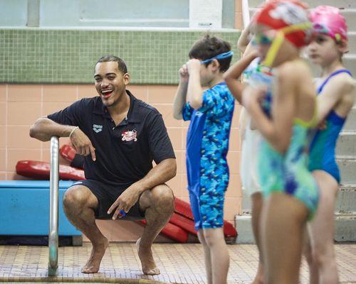 Swim team coaches making a difference every day