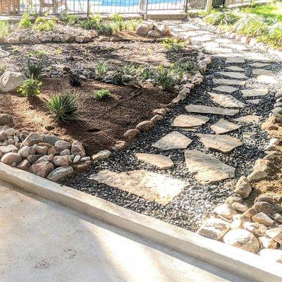 Backyard shaded rock garden w/ flagstone pathway