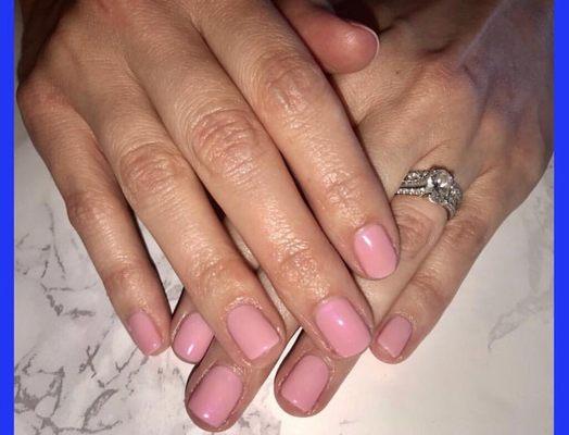 Gel Manicure - Trimming &/or shaping of the nail, buffing, cuticle trimming, scrub, gel polish, & 5 minute massage.