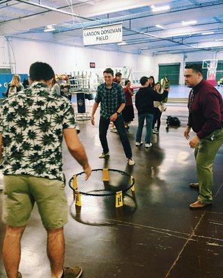 Students play spike ball with our Athletic Director, Coach Duperron, during snack time.