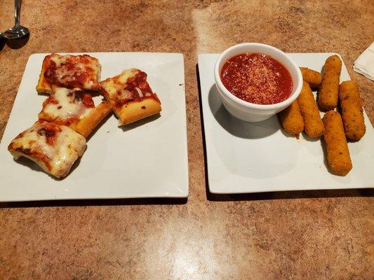 Pizza pieces and cheesesticks