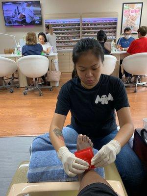 Amy applying OnSen foot mask