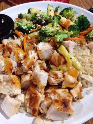 Full size chicken bowl with brown rice and spicy teriyaki sauce