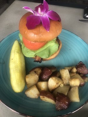 Bacon cheeseburger with side of home fries