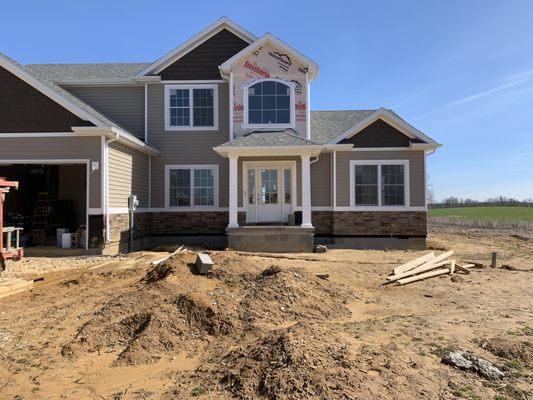 Install LP Siding, Gutters, Columns and New Door