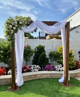 Wooden Ceremony Arch perfect for a backyard micro wedding.