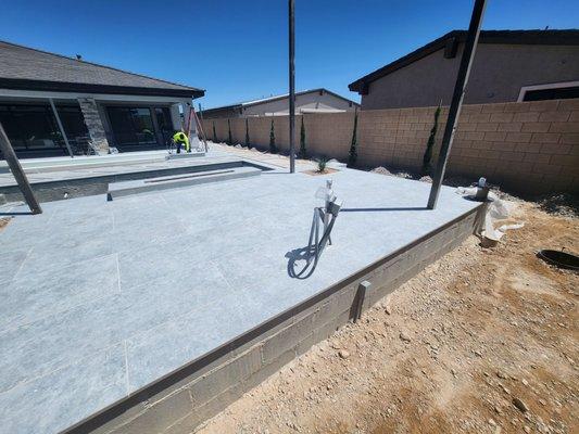 Installed underground to this location and added outlets for a future t v wall at this beautiful custom swimming pool build