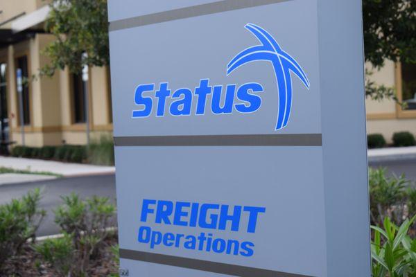 Status Transportation Sign outside of the building.