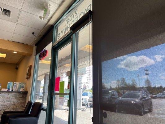 Nice waiting area with roller shades to filter the bright sunlights.