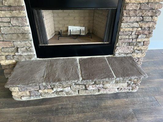 Same "stone mason" that hasn't repaired walls was allowed to place this broken hearth INSIDE my house.