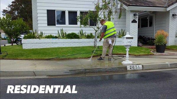 Power washing sidewalk