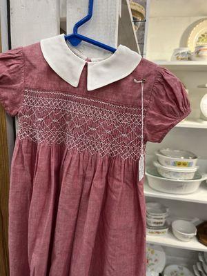 My sister had a dress like this in brown when she was a toddler.