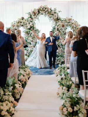 Triple custom floral arch and floral aisle for their gorgeous ceremony at Bella Collina.