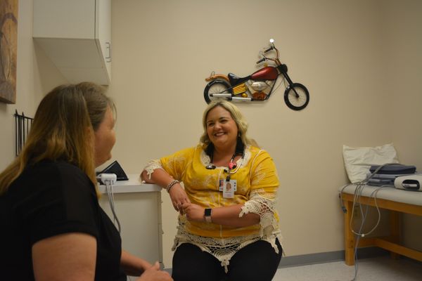 One of our nurse practitioners, April Erwin, with a patient!