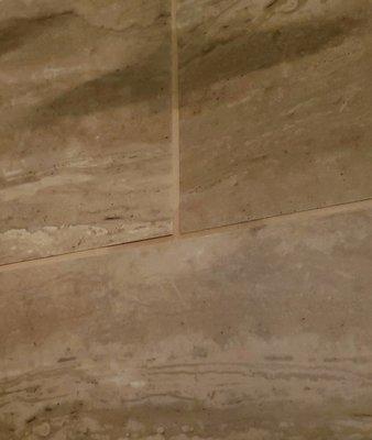 noticably discolored grout at the joints in several places