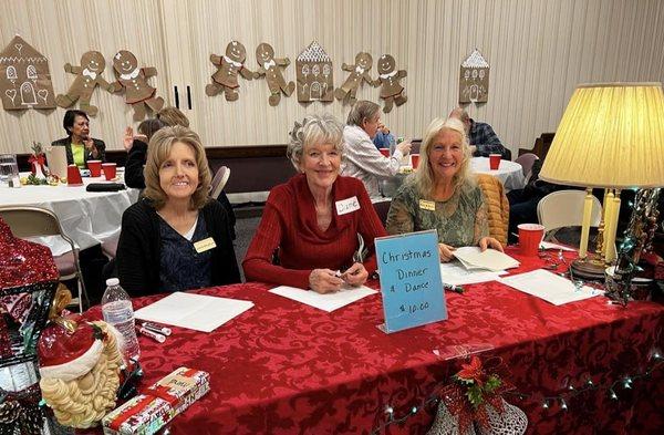 Jamie, Diane and Mary at the sign-in table at the 2022 MTS Christmas Dinner & Dance.