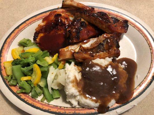 Ribs and chicken dinner with mashed potatoes, gravy and vegetable medley. A homemade meal all for $12.49!