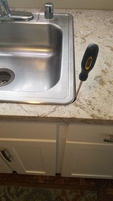 Damage to our Brand new Kitchen Aid Refrigerator and bad cut for sink.