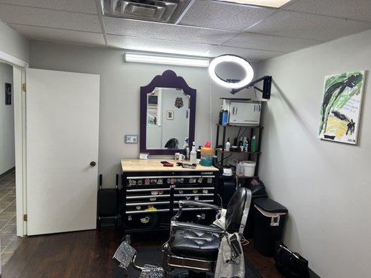 Inside the waiting area looking into the first barber room