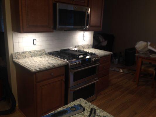 Hard maple cabinets with marbled concrete countertops