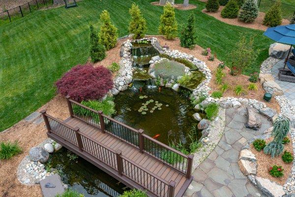 Koi pond feature with composite deck bridge