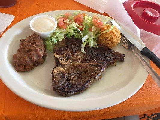 Ribeye with rice and beans and a small salad