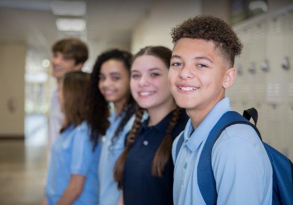 Students gathering in a locker room.