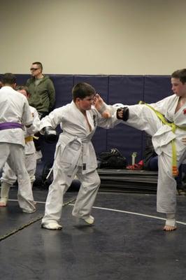 Kids learning self defense.