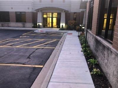 Concrete sidewalk for property management company.