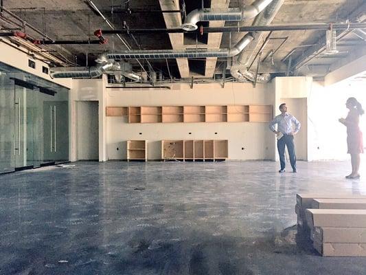 Development ensues... Kitchen cabinets are in... Fresh polish on the concrete floor..