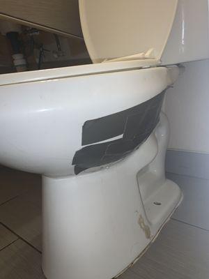 Patched up with duct tape instead of dishing the money out for a new toilet.