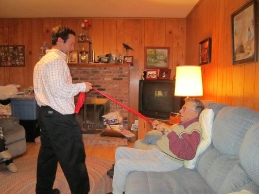 Dr. Warner performing a strengthening technique in the patient's home.