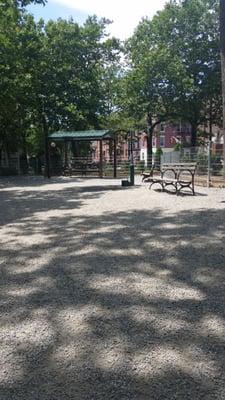 Dog park with gravel and drinking water. Nice size with plenty of seating, clean, & has poop bags available.