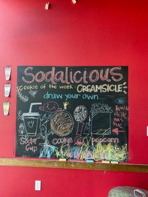 How cute is their chalk wall? Customers can add their own drawings or see the different cookies of the month they offer.