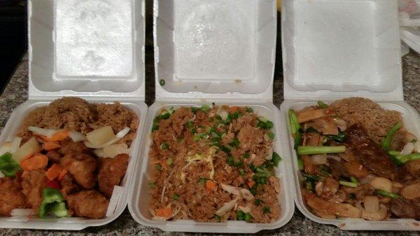 Take out food, from left to right is sweet and sour chicken, chicken fried rice, and Mongolian beef