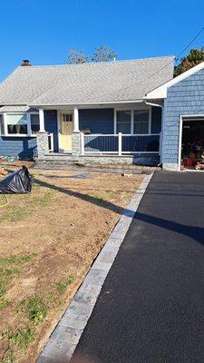 Beautiful asphalt driveway with a new porch