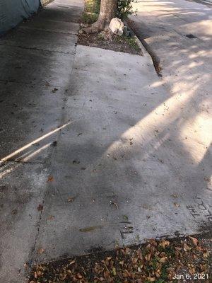 The new driveway apron not to engineering standards and bagged concrete was used with rebar. (no rebar was suppose to be used)