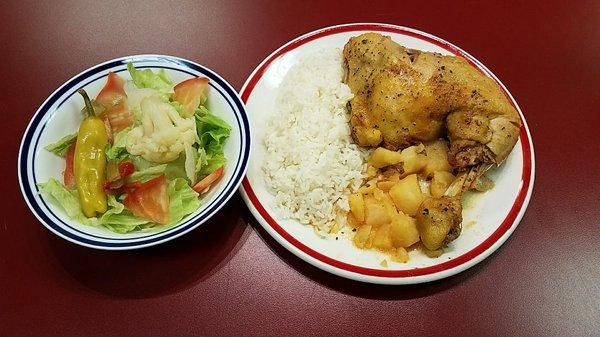 Our Tuesdays lunch Special. 
White rice, pollo guisado ( chicken stew), and a salad with a drink for $6.99.