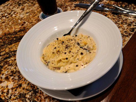 Cacio e Pepe pasta entrée - linguine pasta, truffle, pecorino romano, cracked black pepper.