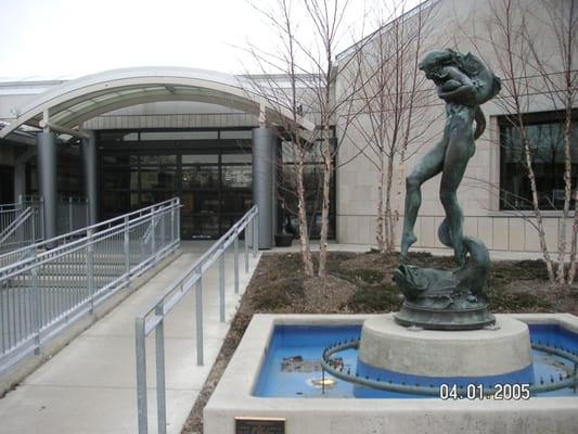 External entrance ramp and fountain statue