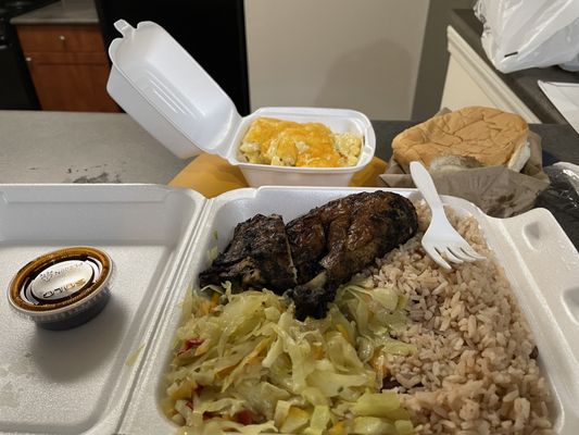 Jerk chicken with rice and cabbage. Plus a side of mac and cheese and some coco bread.