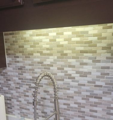 Tile backsplash installed.