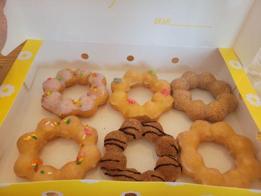 From top left  Uber, mango, churro Vanilla, churro, original glazed  $18