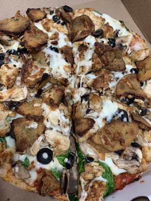 Eggplant chicken mushroom spinach and olives pizza