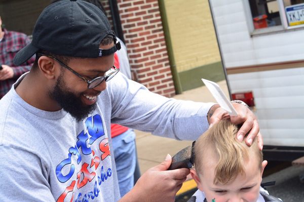 Happy Frank giving away a free haircut to this young man!