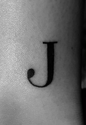 My J tattoo