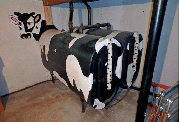 Cute way to make fuel oil tanks fit into the basement