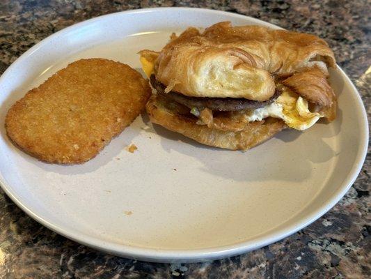 Sausage patty egg and cheese on a croissant (photo taken at home)